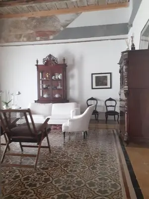 a living room with two chairs and a couch at Domus 31 in Palermo