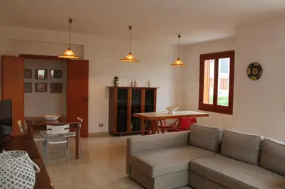 a living room with a couch and a table at Villa Fede & Niki in San Vito lo Capo