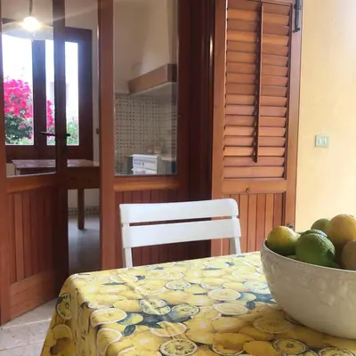 a bowl of fruit on a table in a kitchen at Villa Fede & Niki in San Vito lo Capo