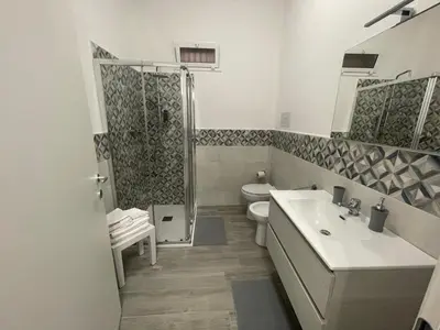 a bathroom with a sink and a toilet and a shower at OUR BEAUTIFUL SICILY in Palermo
