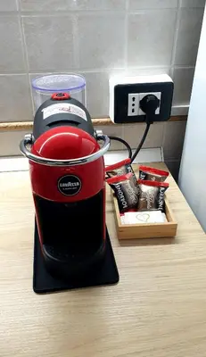 a red blender sitting on top of a counter at I Vicini del Re Holiday Home in Palermo