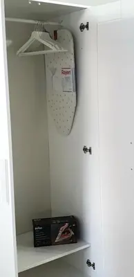 a box is sitting on a shelf in a closet at I Vicini del Re Holiday Home in Palermo