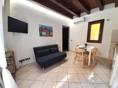 a living room with a couch and a table at I Vicini del Re Holiday Home in Palermo