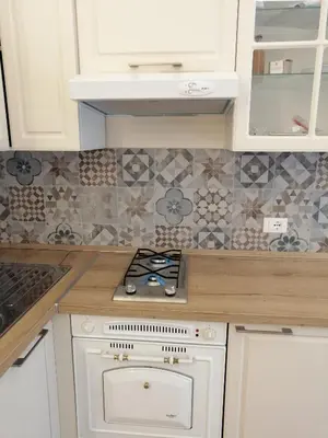 a kitchen with a stove top oven in a kitchen at Casa Dadà, romantic house in historic centre in Palermo