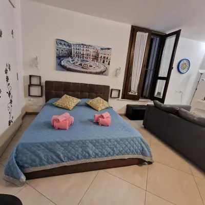 a bedroom with two pink hello kitty pillows on a bed at Aspettando Vossia in Palermo