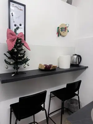 a black shelf with a christmas tree on it at Casetta Mape in Palermo