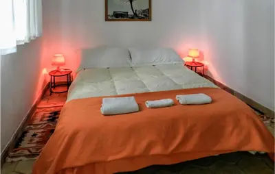 a bedroom with a bed with two pillows on it at Acque Di Palermo in Roccapalumba