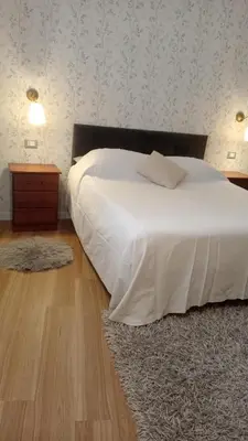 a bedroom with a bed and a lamp in a room at BeeClaire Guest House in Palermo