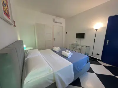 a bedroom with a bed with two towels on it at Casa Galati in Palermo