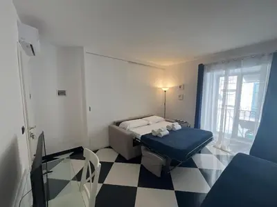 a small room with a bed and a window at Casa Galati in Palermo