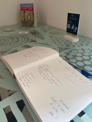 a book sitting on top of a glass table at Casa Galati in Palermo