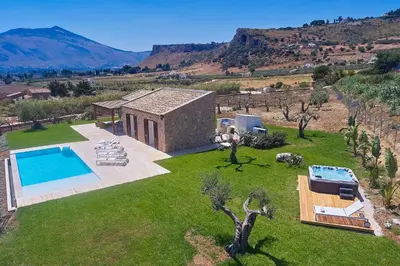 an aerial view of a house with a swimming pool at VILLA DEL BORGO con piscina e jacuzzi in Scopello