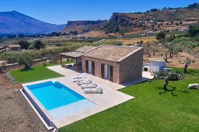 an aerial view of a house with a swimming pool at VILLA DEL BORGO con piscina e jacuzzi in Scopello