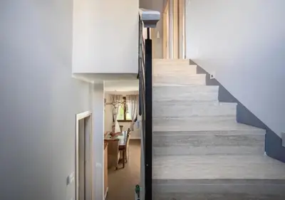 a hallway with a staircase in a house at Seaside Villa in Carini