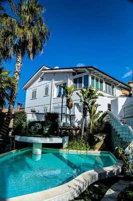 a house with a swimming pool in front of a house at Leon D'Oro in Corleone