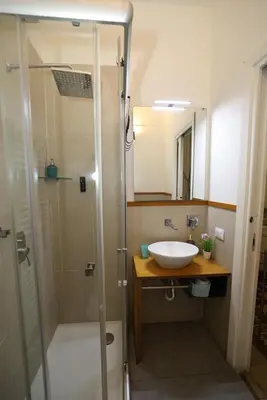 a bathroom with a sink and a shower at Ai Tintori in Palermo