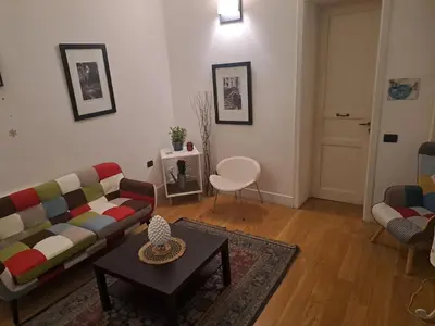 a living room with a couch and a table at Ai Tintori in Palermo