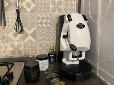 a white mixer sitting on a counter in a kitchen at Cozy apartment near Palermo Cathedral in Palermo