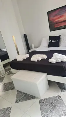a bedroom with two beds with towels on them at Casa Cristy palermo in Palermo