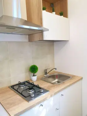 a small kitchen with a sink and a stove at Mondello sicily apartament in Mondello
