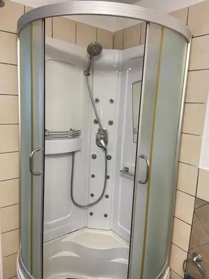 a shower with a shower head in a bathroom at FronteMare in Palermo