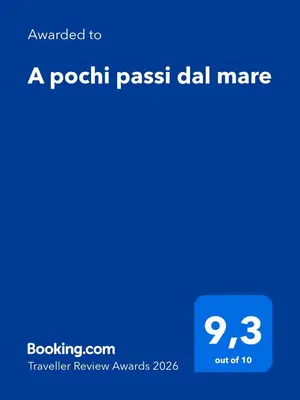 a dining room with a table and chairs at A pochi passi dal mare in Mondello