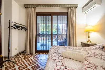 a bedroom with a bed and a large mirror at A pochi passi dal mare in Mondello