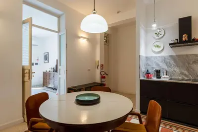 a white room with a dresser with a lamp on it at Faboulous Flat in Palermo