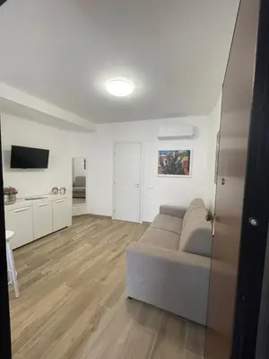 a living room with a couch and a television at Casa Himera Palermo in Palermo