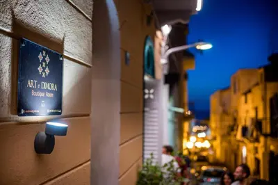 a sign on the side of a building at Art e Dimora - Boutique Room. in Castellammare del Golfo