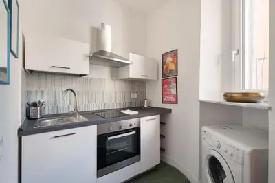 a small kitchen with a sink and a dishwasher at 124 Maqueda Apartments in Palermo