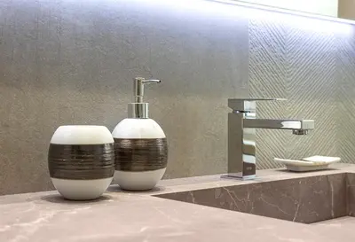 a bathroom sink with a soap dispenser on a counter at Casa Imperia in Palermo
