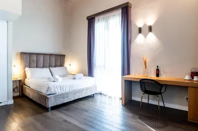 a red bag sitting on a table in a room at Bastione Spasimo Boutique Hotel in Palermo