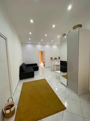 a living room with a couch and a rug at Marechiaro Apartments in Palermo