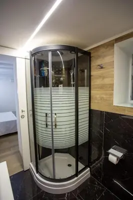 a shower with a glass enclosure in a bathroom at Francesco's Home Palermo in Palermo