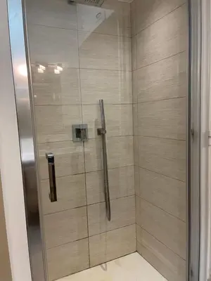 a shower with a glass door in a bathroom at Grande Sole Siciliano in Palermo