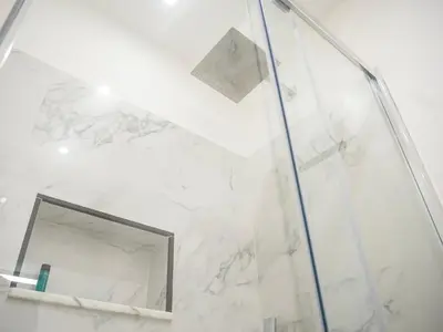 a bathroom with a shower and a mirror at Aliva apartment LT in Palermo