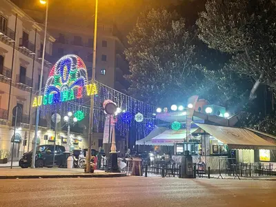 a city street at night with a christmas lights at Aliva apartment LT in Palermo