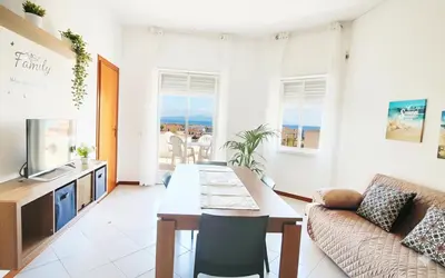 a living room with a couch and a table at Marea il tuo angolo di paradiso in Sicilia ti aspetta prenota ora e vivi la magia del Mediterraneo in Alcamo Marina