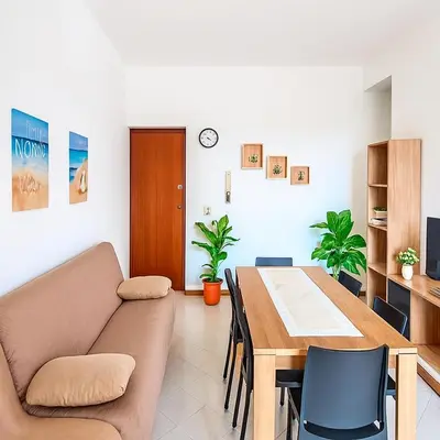 a living room with a couch and a table at Marea il tuo angolo di paradiso in Sicilia ti aspetta prenota ora e vivi la magia del Mediterraneo in Alcamo Marina