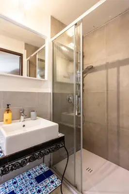 a bathroom with a sink and a shower at Casa Carolino in Palermo