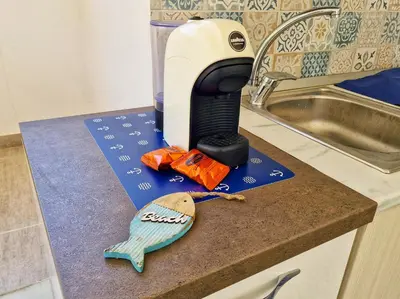 a hair dryer on a counter next to a sink at Casa vacanze A&G in Castellammare del Golfo