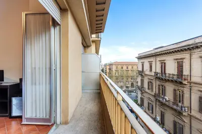 an apartment balcony with a view of a city at Crisol Europa in Palermo