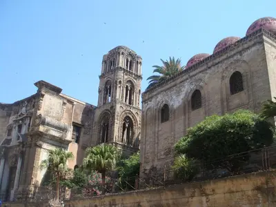 an old building with a tower and a church at Al Khalisa Apartment by Wonderful Italy in Palermo