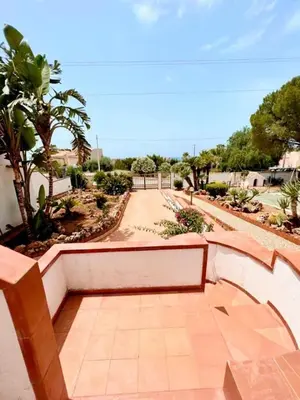 a walkway in a park with trees and bushes at Villa San Vito Bay in Macari