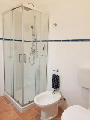 a bathroom with a shower and a toilet at Villa delle Pomelie - Castellammare del Golfo in Alcamo