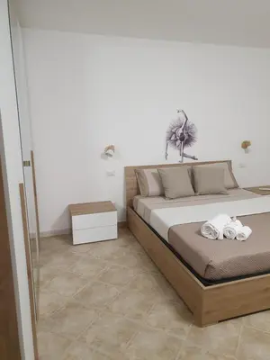 a bedroom with a bed with towels on it at Dancing Apartment in Castelluzzo