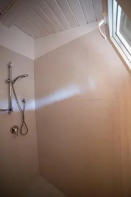 a shower stall in a bathroom with a window at Le Yucche in Partinico