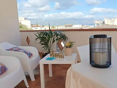 a living room with a couch and a table at Limoncello Apri la finestra e respira il profumo del mare Alloggio Spazioso in Sicilia Comfort per 6 Ospiti in Castellammare del Golfo