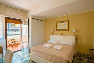 a bedroom with a bed with two towels on it at Le Stanze dei Tesori - Luxury Rooms in Palermo